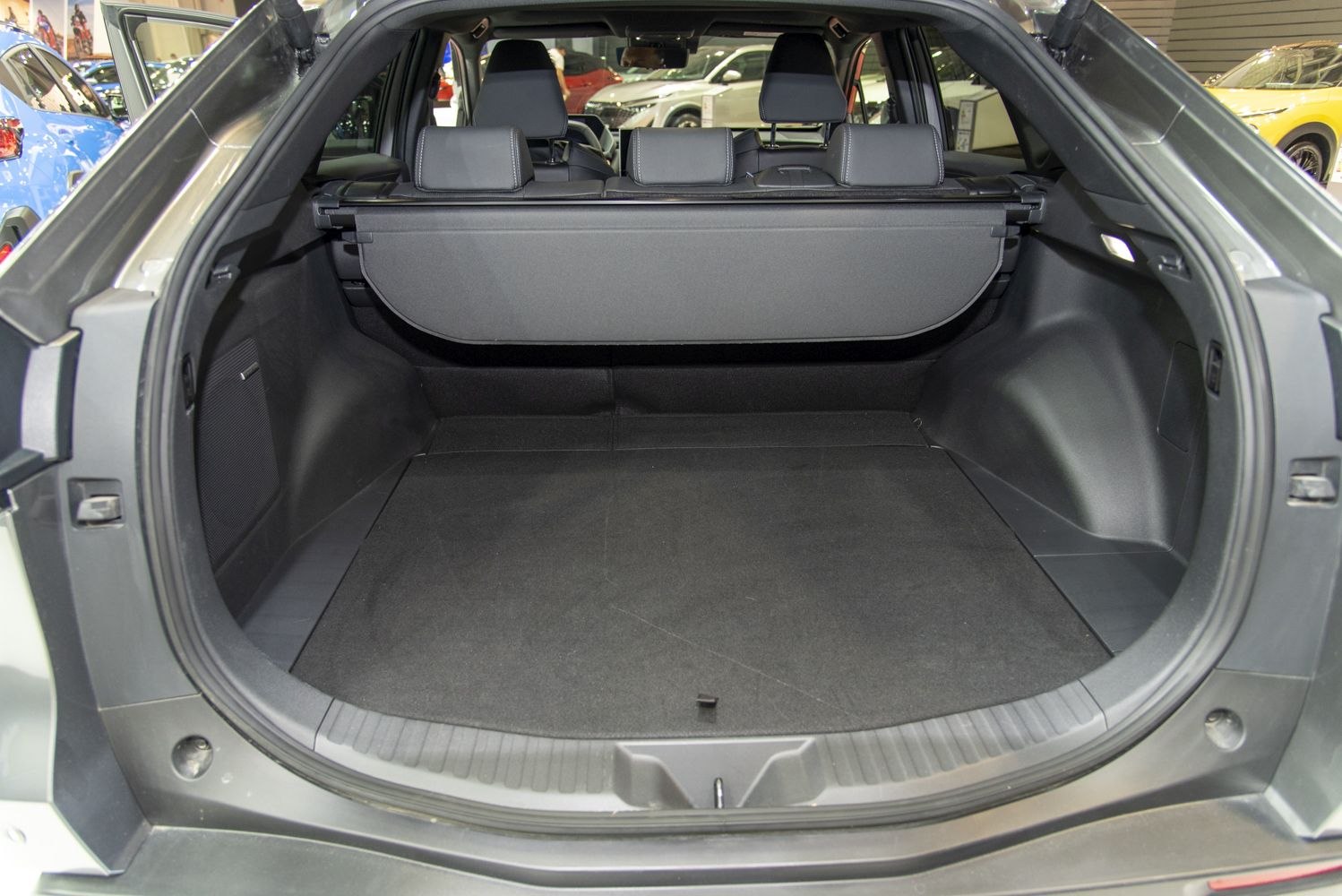 Spacious rear cargo trunk interior with protective cargo cover