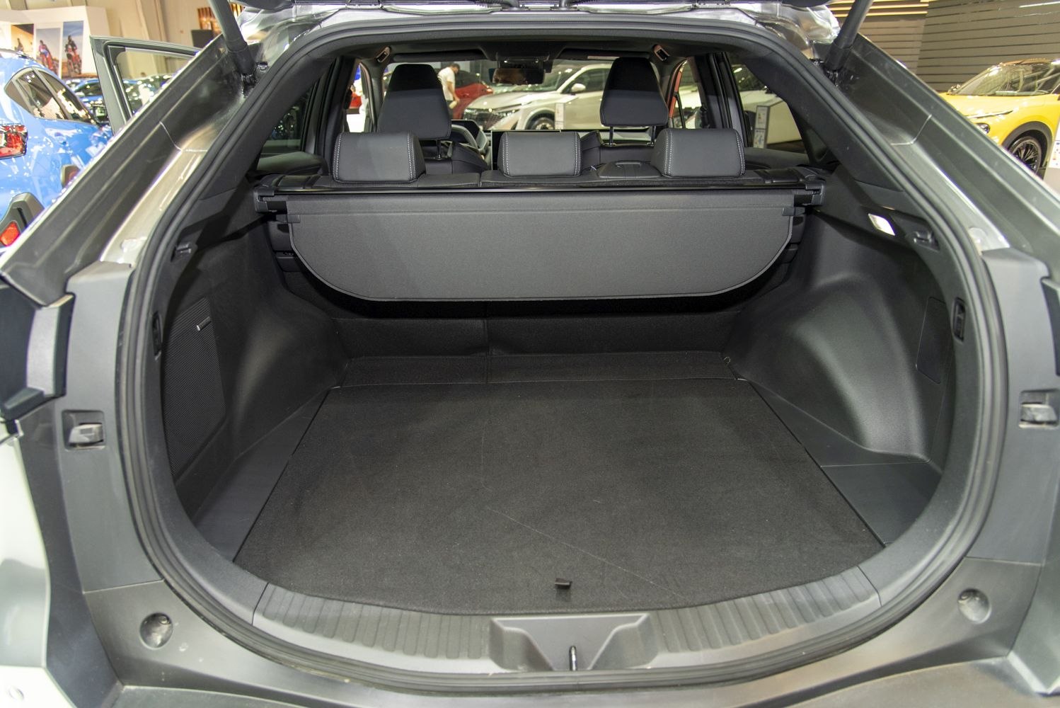 Spacious rear cargo area with storage cover and rear seats