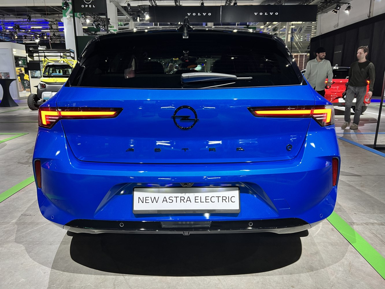 Rear view with LED tail lights and electric badge on blue hatchback