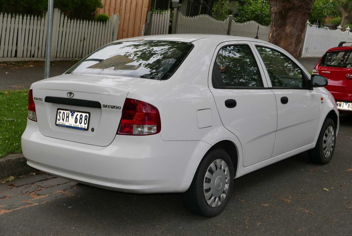Rear view of a compact sedan with rounded taillights and smooth rear curves