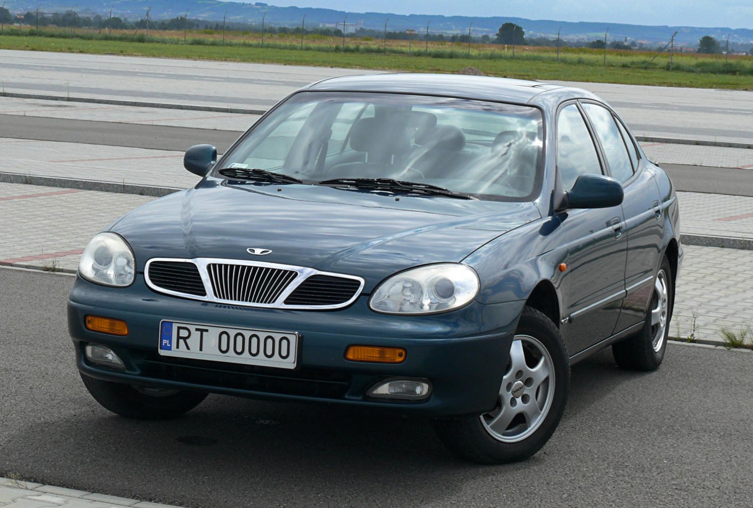 Front angle view showing grille, headlights, and wheels