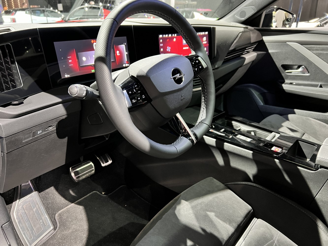 Close-up of Opel steering wheel with dual digital instrument displays