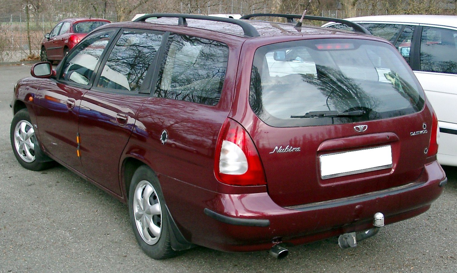 Rear view of a classic station wagon with large tailgate and roof rails
