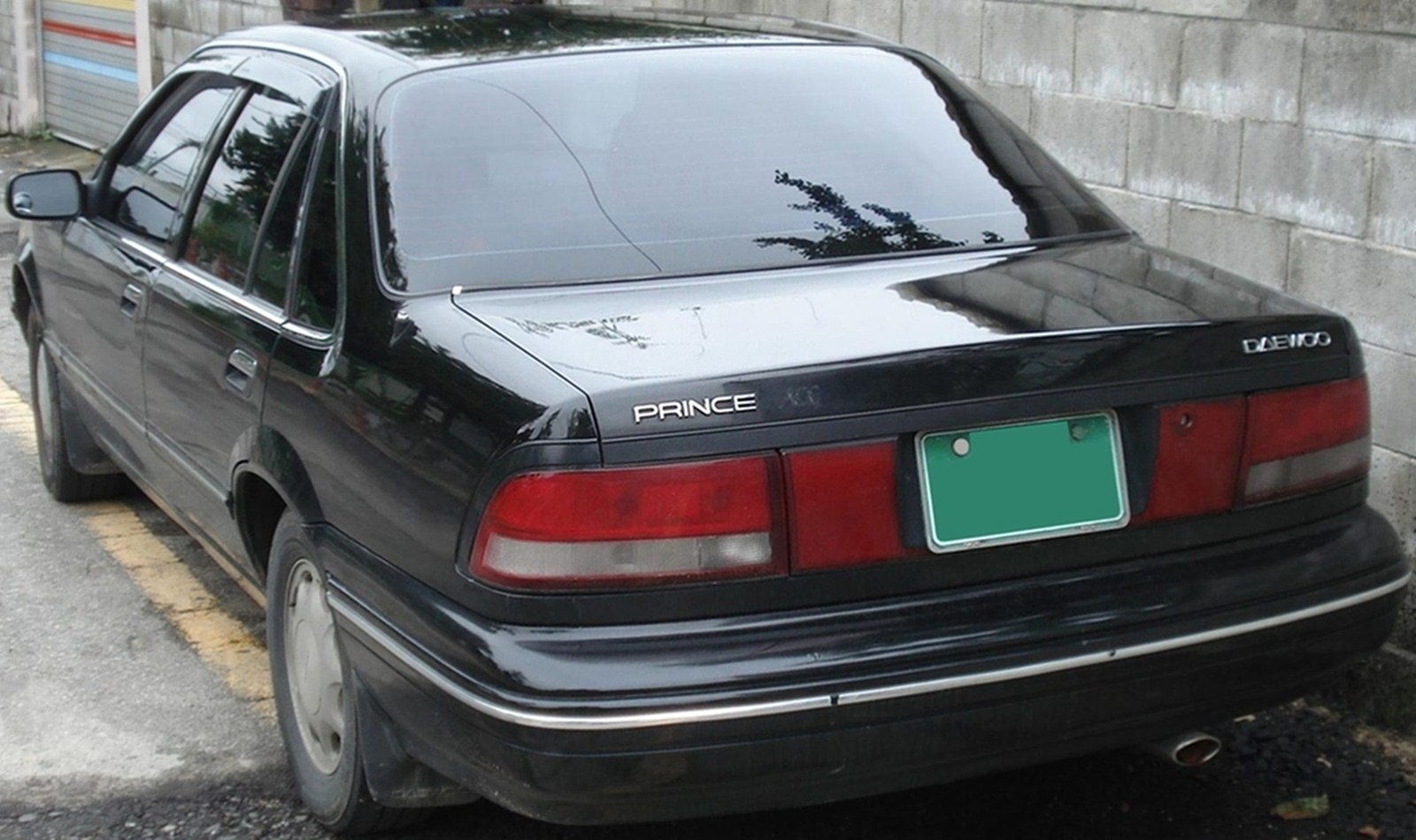 Rear view with tail lights and badges on a sedan