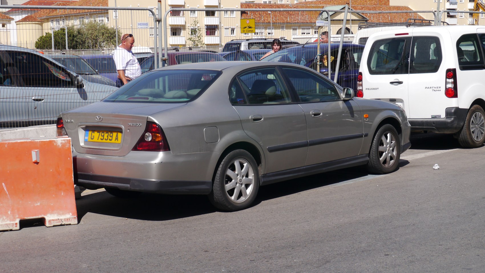 Rear and side profile of a four-door sedan with alloy wheels