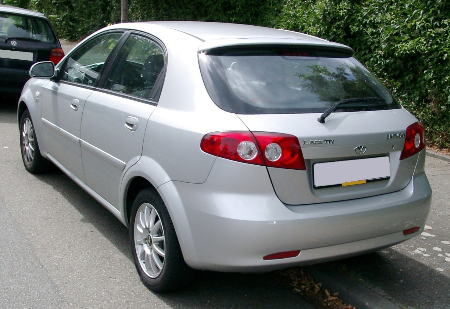 Rear view of a hatchback with distinctive tail lights and rear window features
