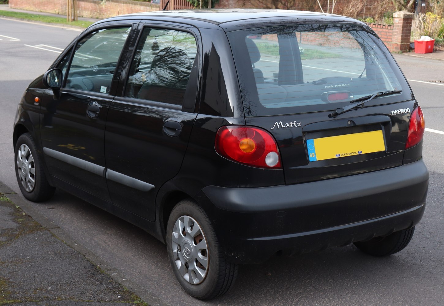 Rear and side view of a compact hatchback with distinctive taillights.