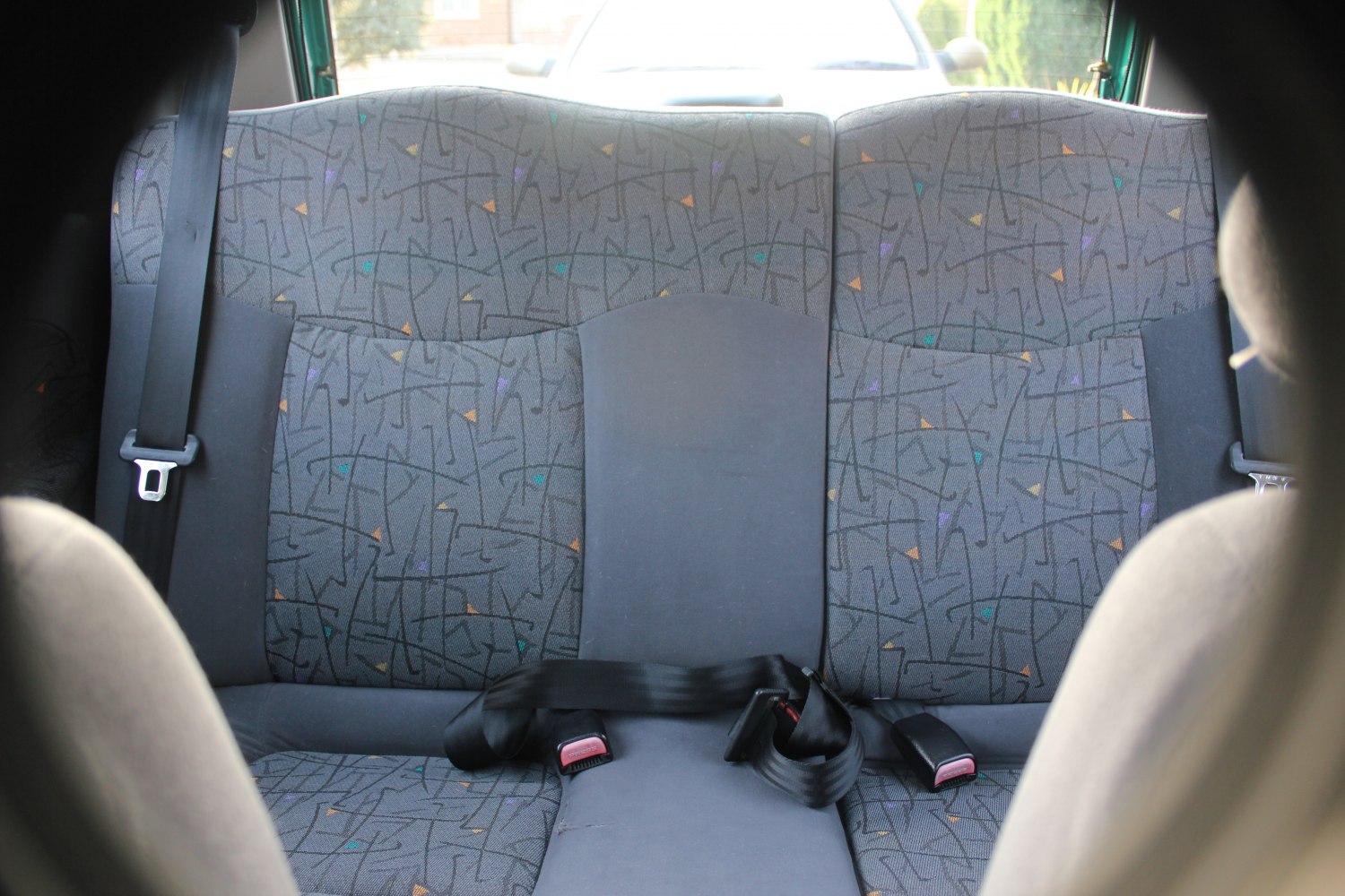 Rear seat fabric pattern with seatbelt design.
