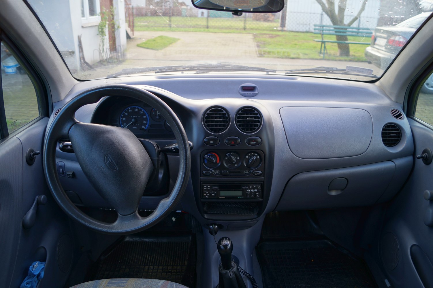 Interior dashboard, steering wheel, manual transmission