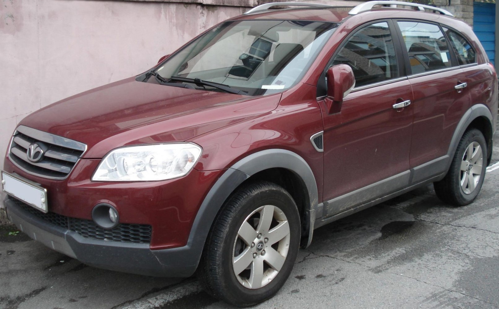 Front side view of rugged mid-size SUV with distinct grille and wheel arches