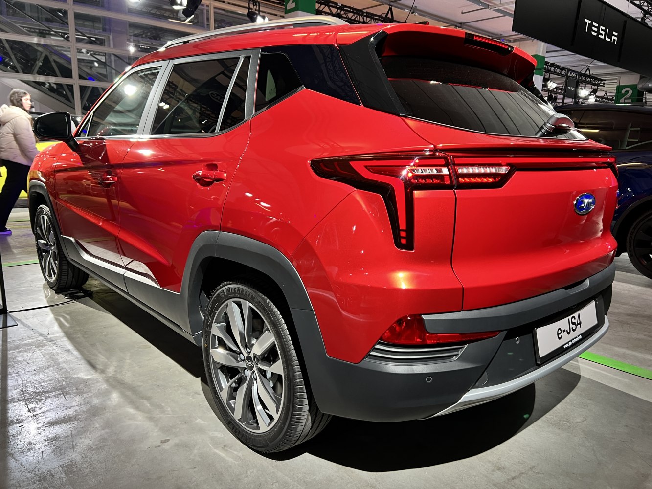 Red SUV rear view with LED taillights and sporty multi-spoke wheels
