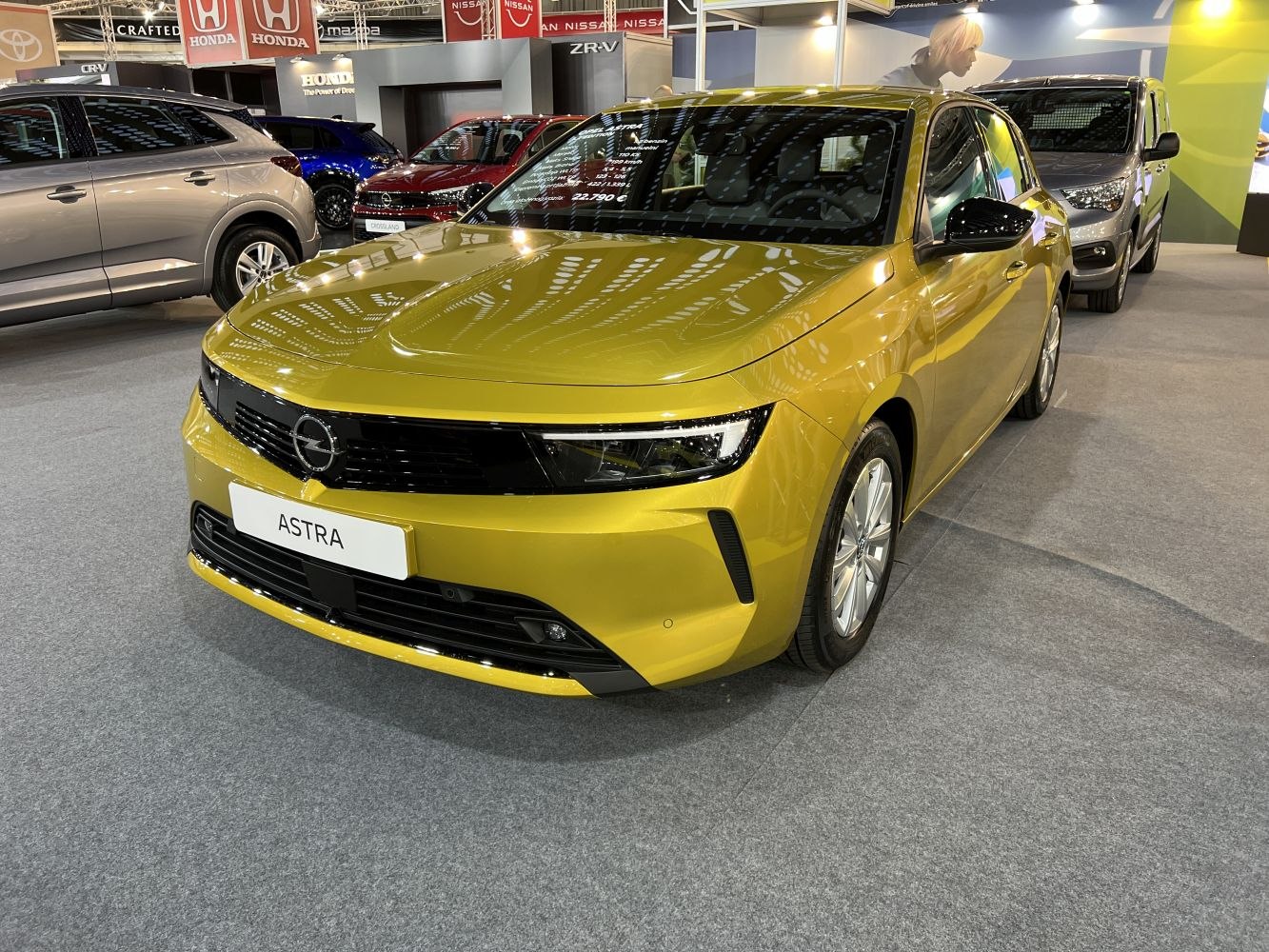Metallic yellow car front with sharp LED headlights