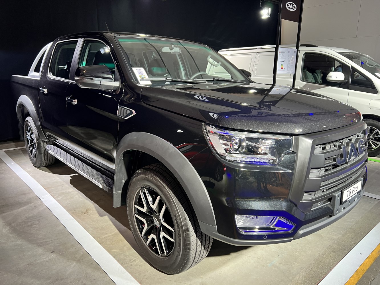 Black pickup truck with large grille and alloy wheels