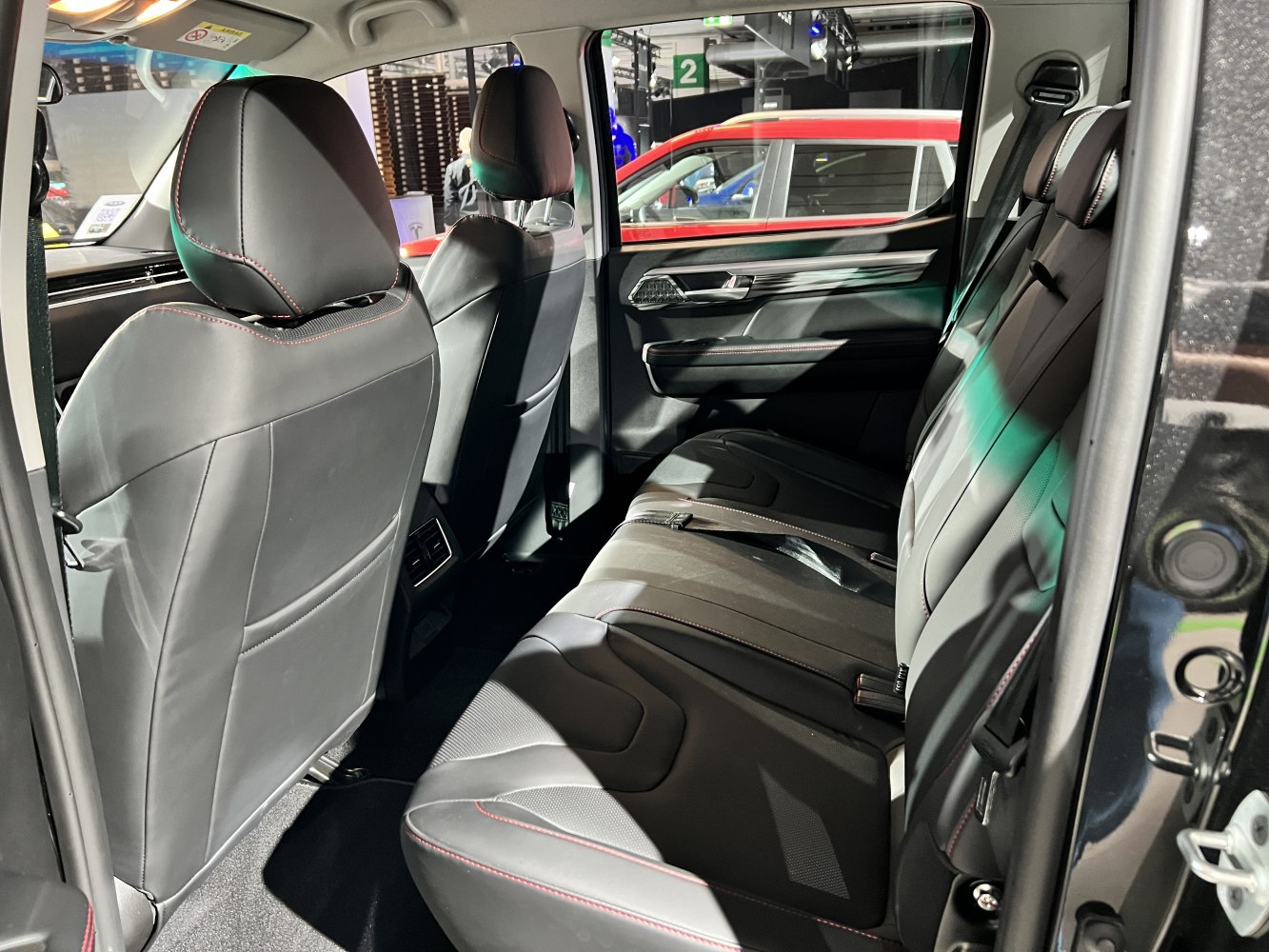 Rear interior with leather seats and door panel.