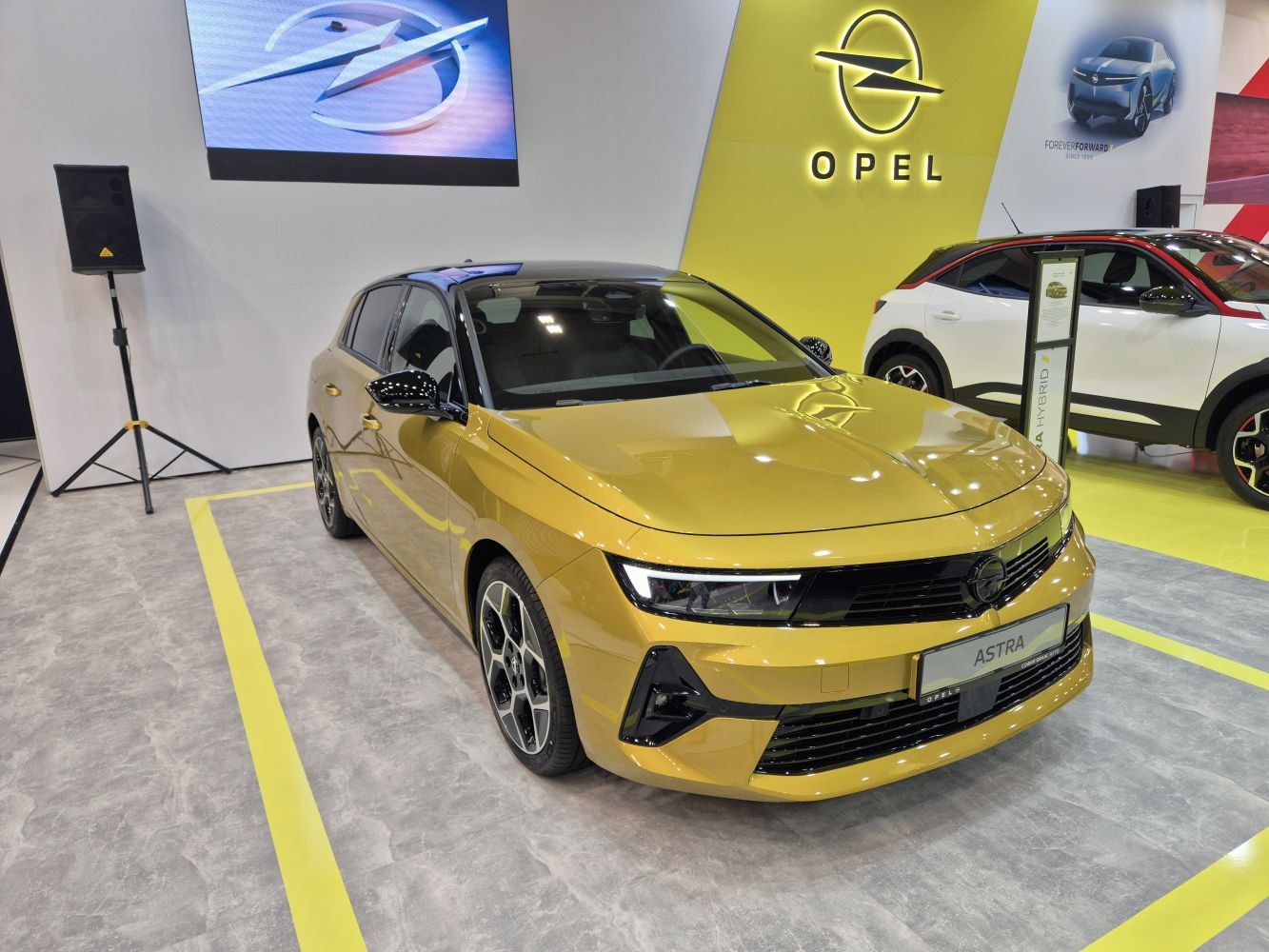 Yellow hatchback with LED headlights and sporty front grille