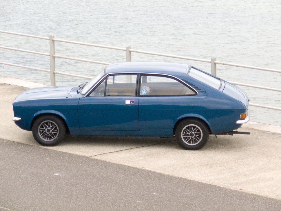 Side profile and distinctive rear design of a vintage two-door coupe