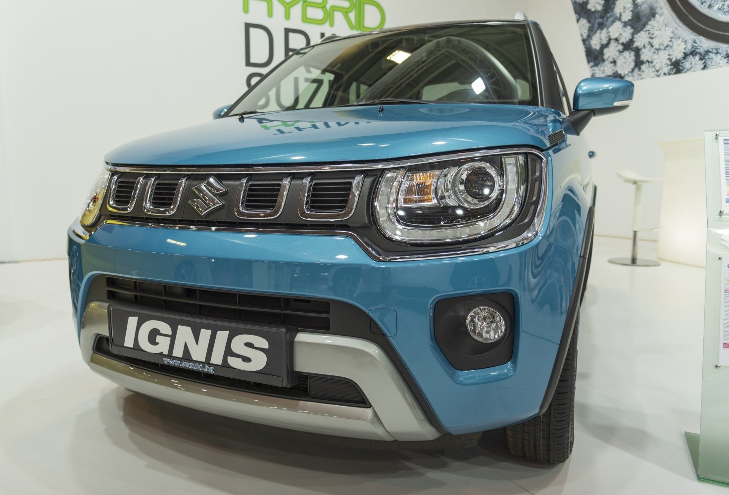 Front view with headlights and grille of a compact vehicle