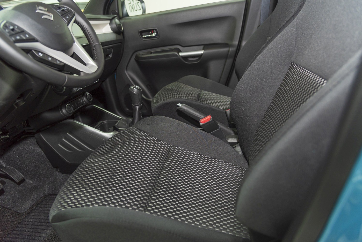 Front seats with patterned fabric upholstery and modern car cabin layout