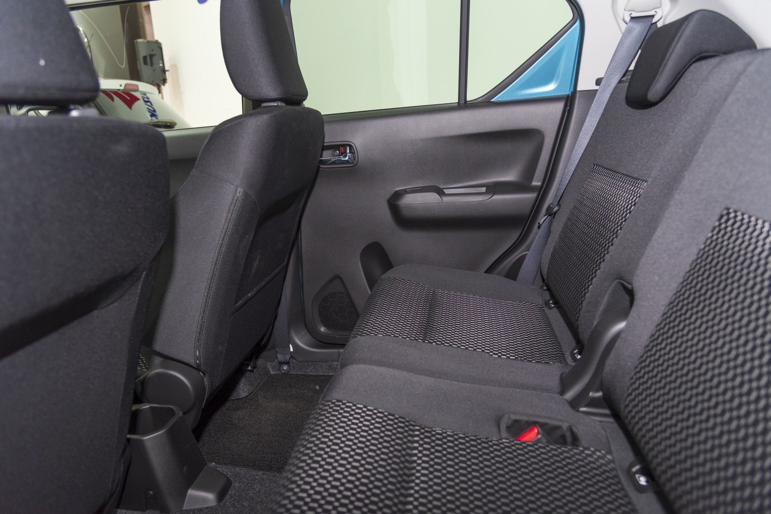 Rear seating area with fabric upholstery and seat belts