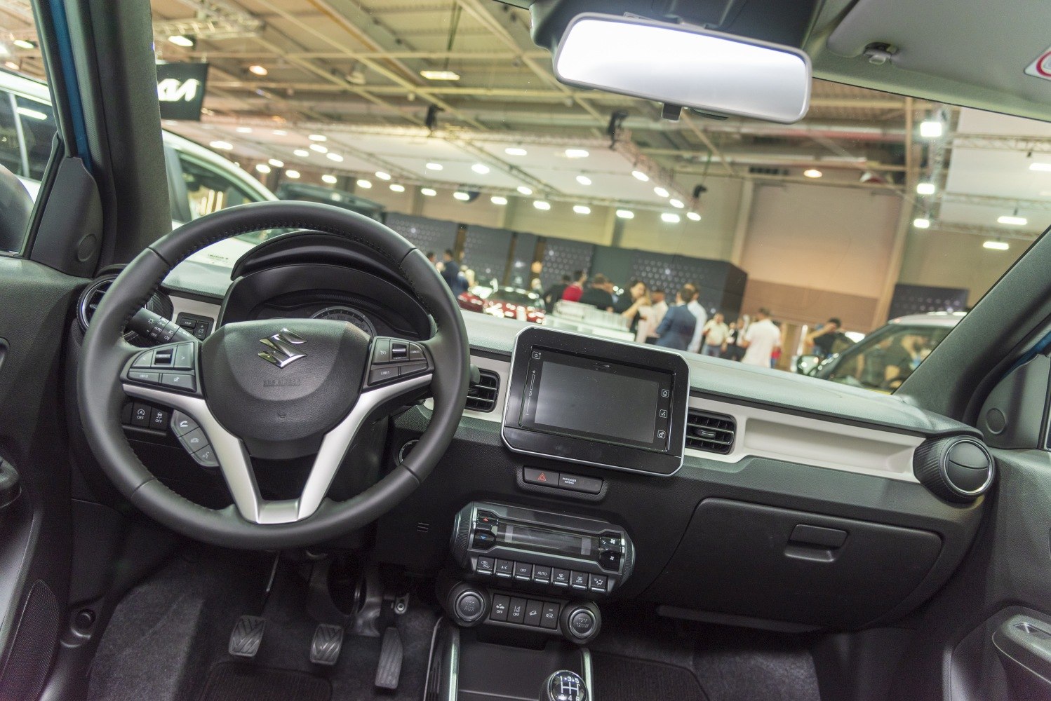 Modern car interior with dashboard, steering wheel, and infotainment screen