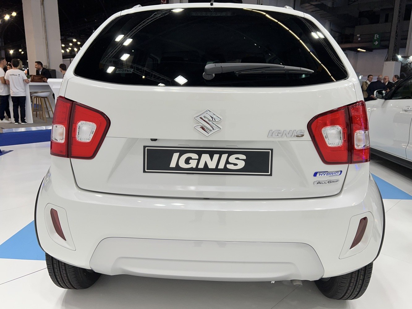 Rear view of hatchback with hybrid and all-wheel drive badges