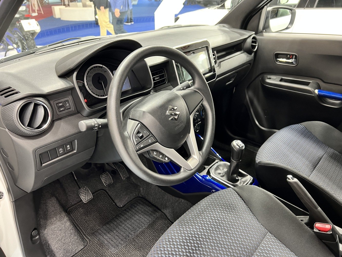 Driver's cockpit with manual gearshift and modern dashboard design