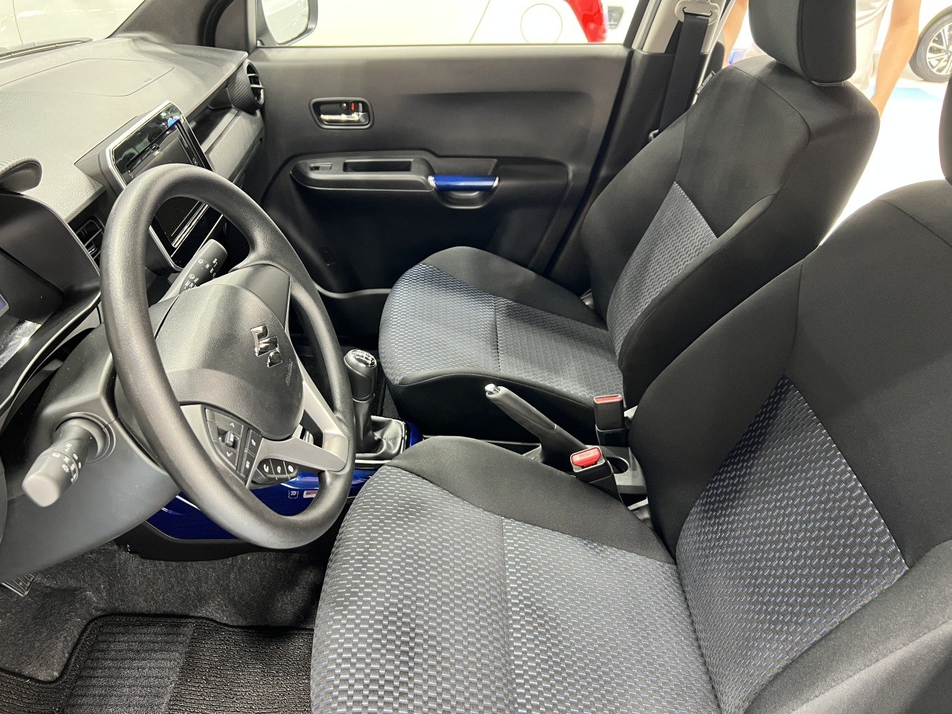Fabric seats and dashboard layout with manual gear shift