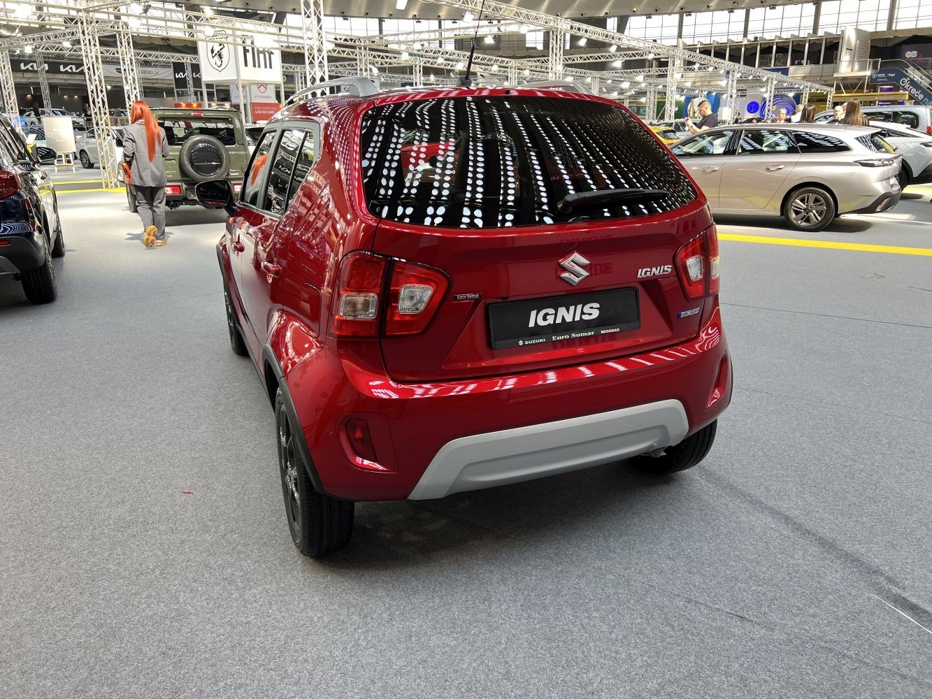 Rear red compact SUV with black alloy wheels and tinted windows