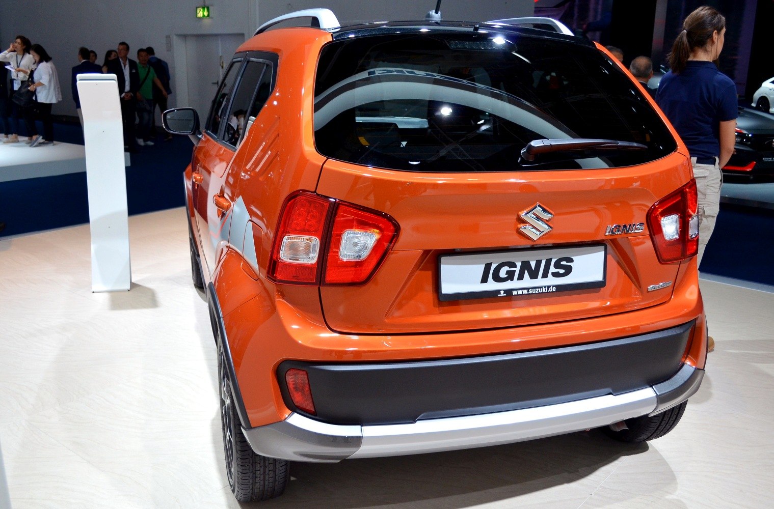 Rear view of a compact hatchback with distinct rear taillights and roof rails.