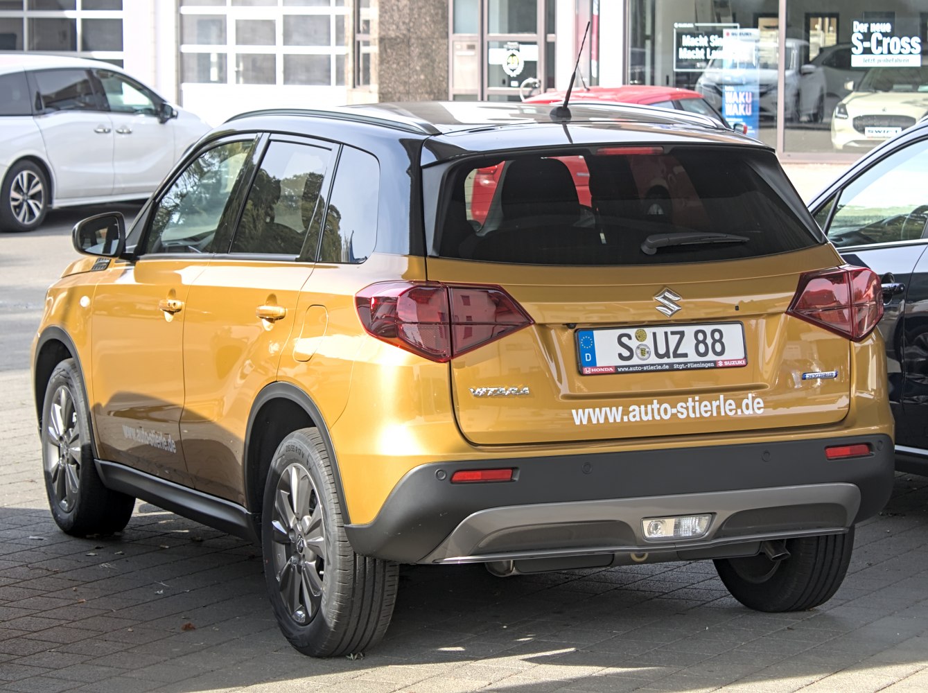 Rear view of compact SUV with hybrid badge and two-tone roof