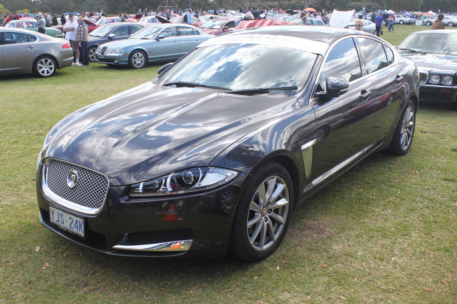 Front and side views showing sleek headlights and alloy wheels.