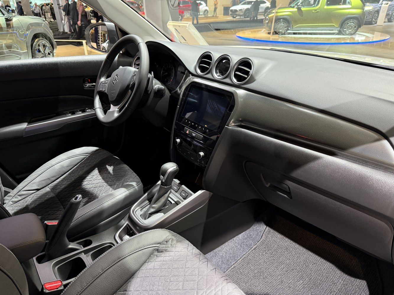 Modern car interior with round air vents and touchscreen display