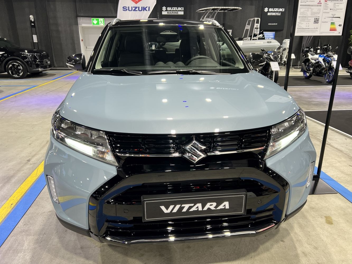 Front view of a modern SUV with LED headlights and distinctive black grille.