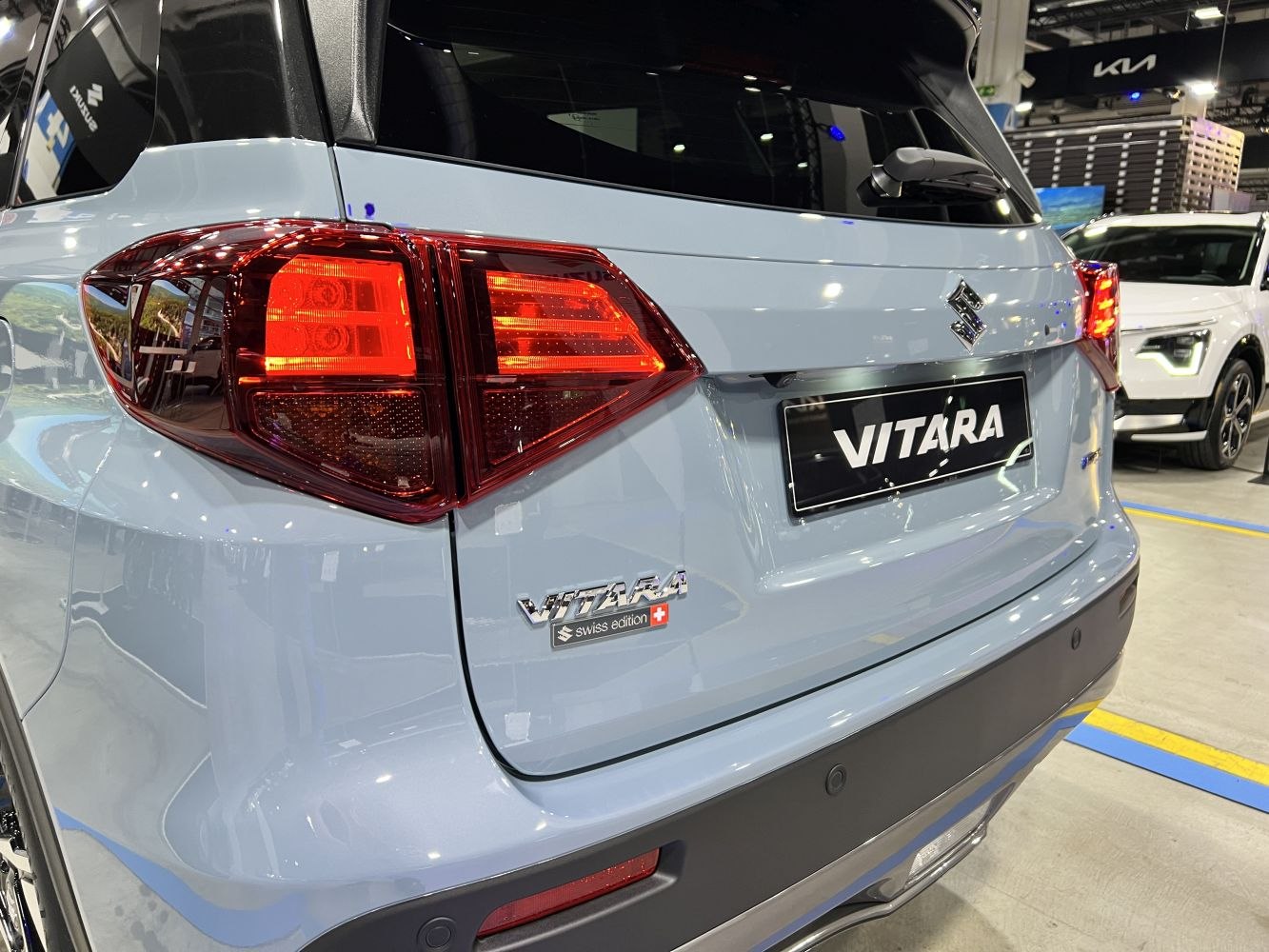 Rear view of SUV featuring LED tail lights and a model badge with Swiss edition emblem