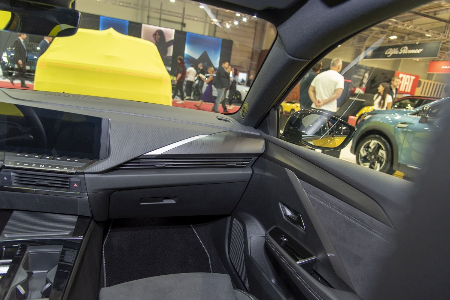 Modern dashboard and door panel with infotainment screen and controls
