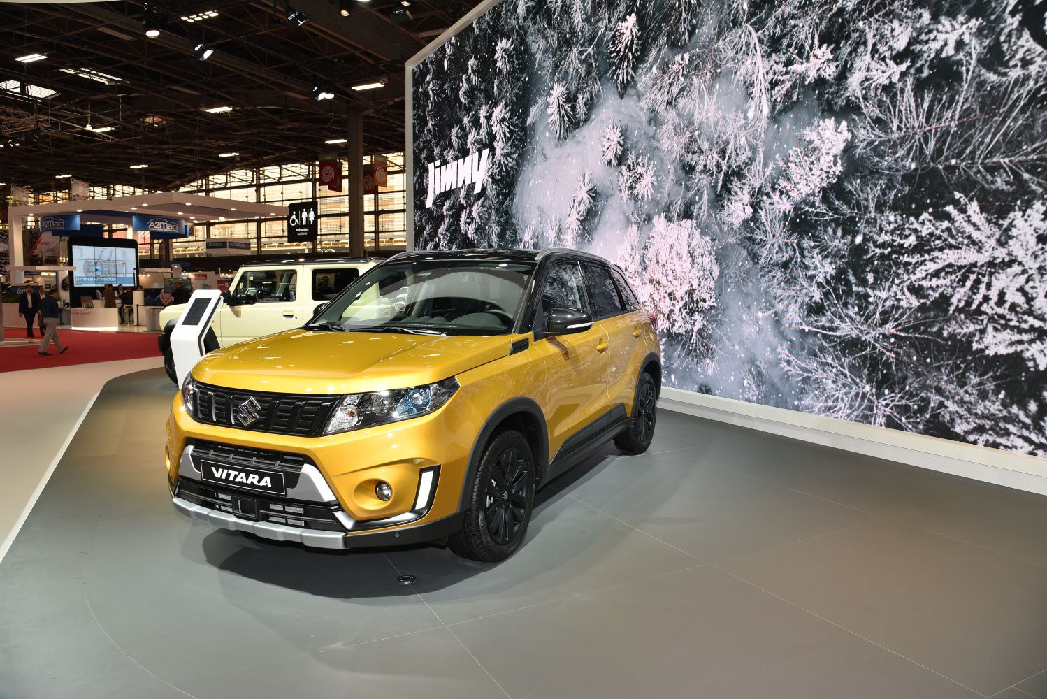 Front view of yellow SUV with black accents and bold grille