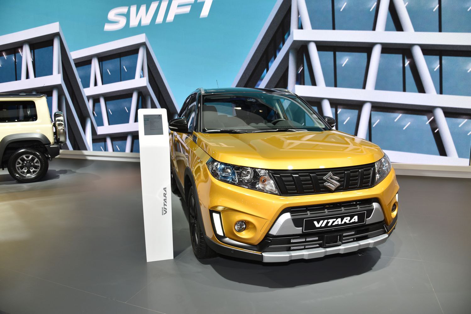 Front view of a modern compact SUV with distinctive headlights and grille.
