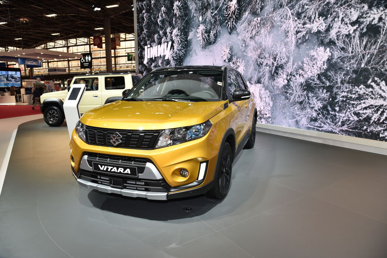 Yellow compact SUV front view with bold grille and modern headlights