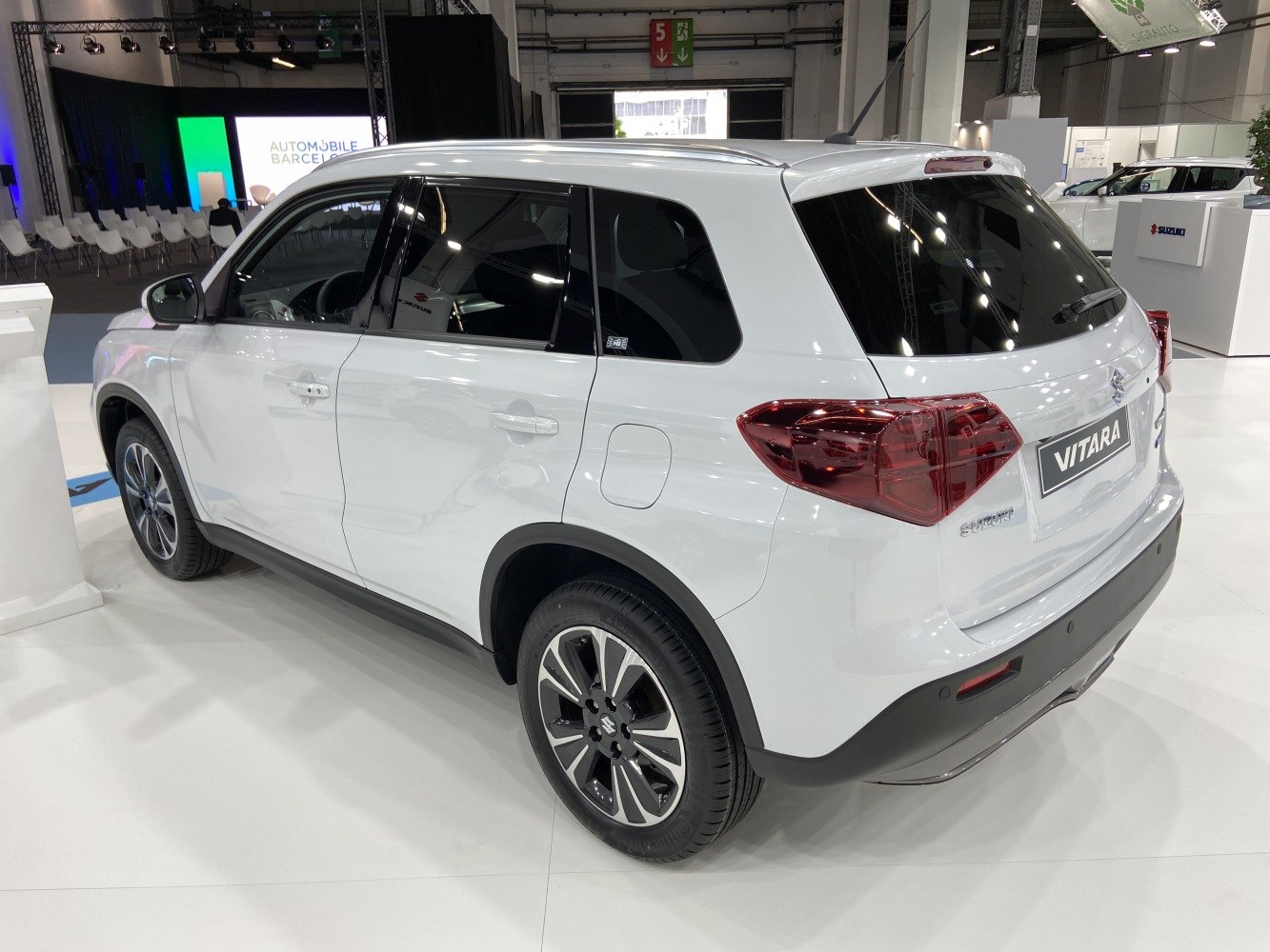 Rear side view of white SUV with modern taillights and alloy wheels