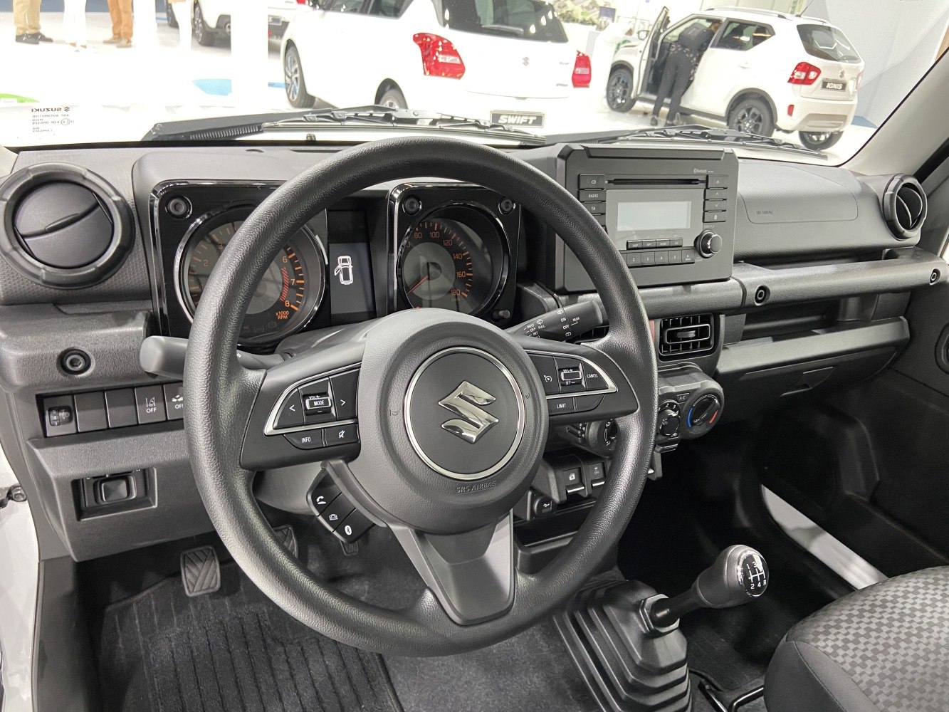 Interior dashboard with steering wheel and manual gear shift