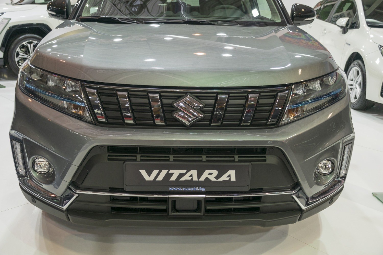 Close-up of front grille, headlights, and fog lights of a modern SUV