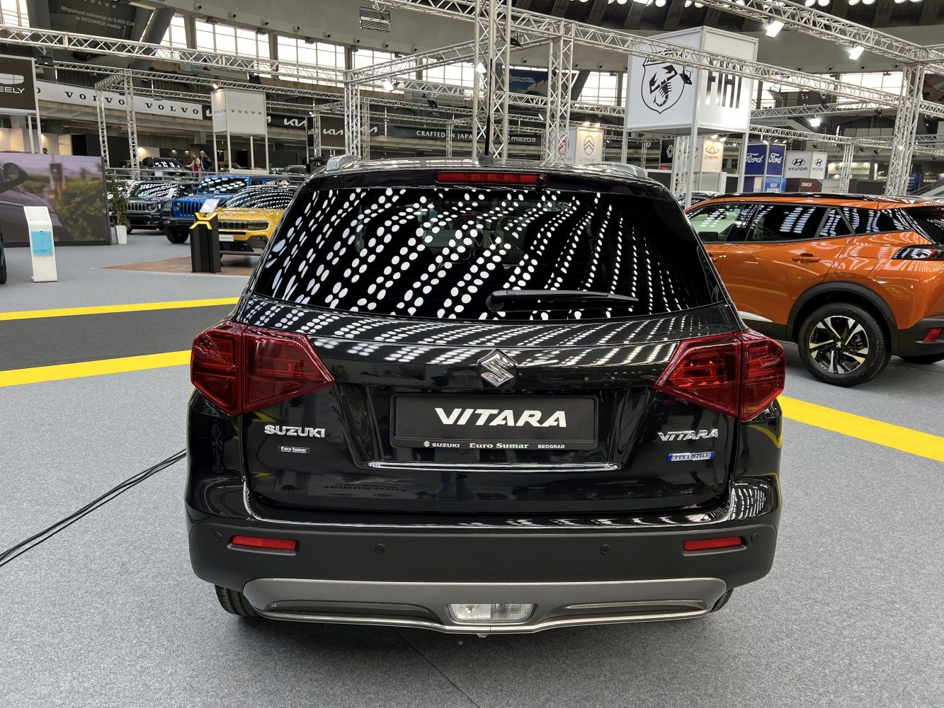 Rear view of black SUV with hybrid badge and distinct taillights