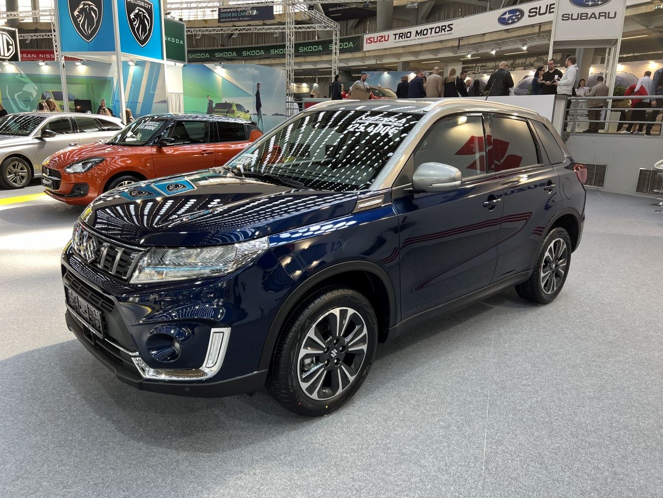 Dark blue compact SUV with updated front grille and LED headlights.