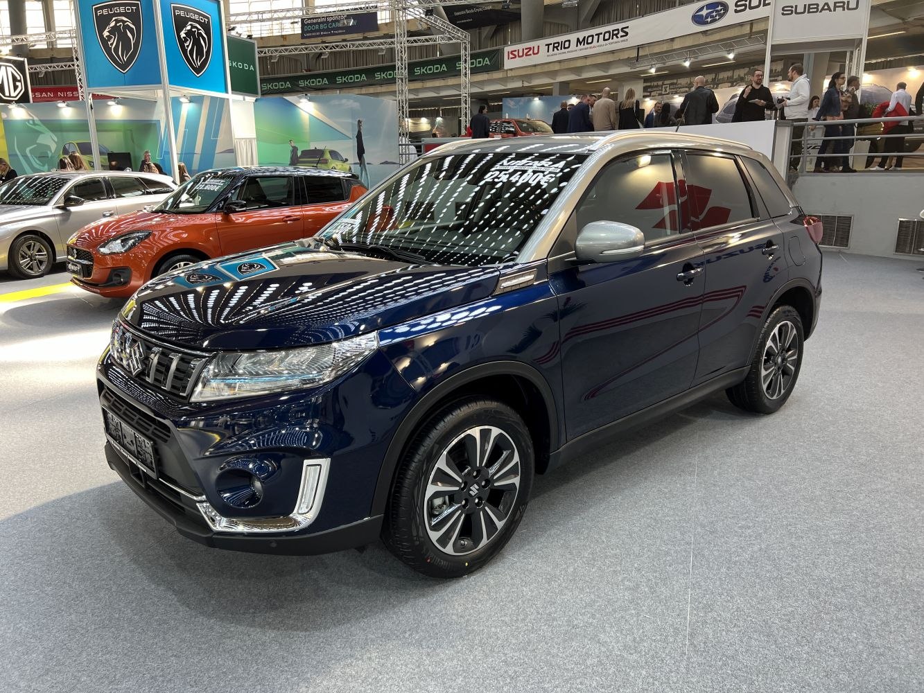 Front and side profile of a modern SUV with alloy wheels and sharp headlights.