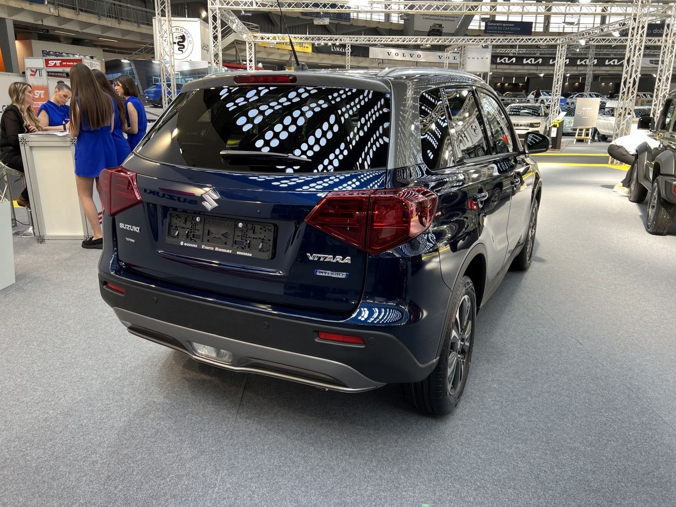 Rear view of modern SUV with hybrid badge and distinct taillights