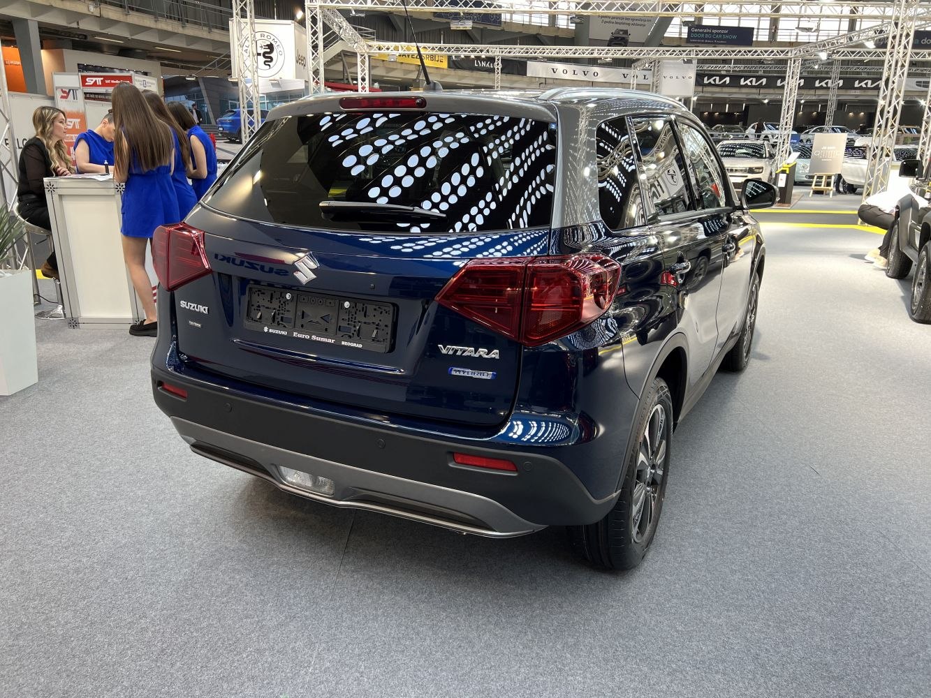 Rear view of SUV with distinct taillights and hybrid badge