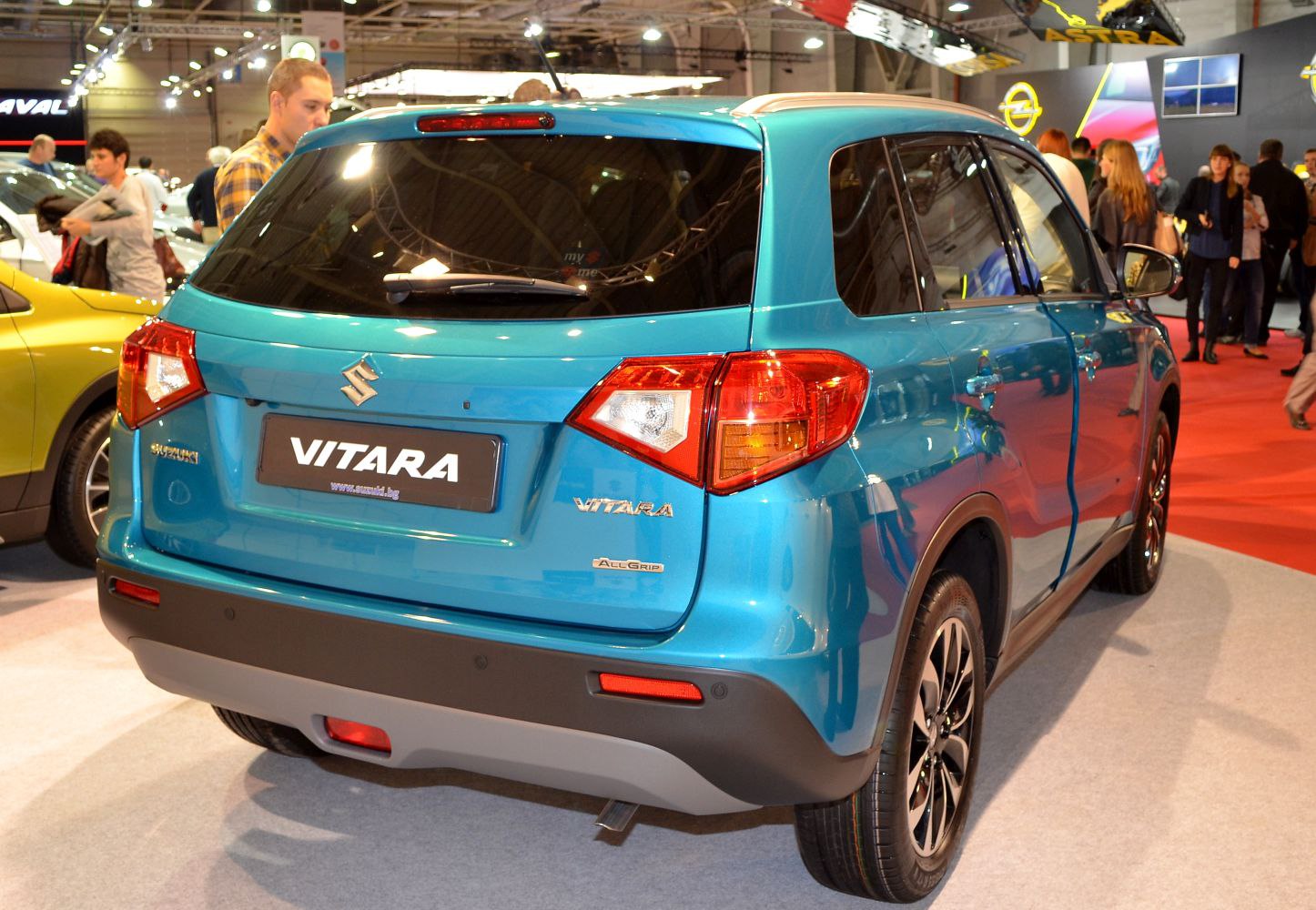 Rear and side view of a blue compact SUV with AllGrip badge.