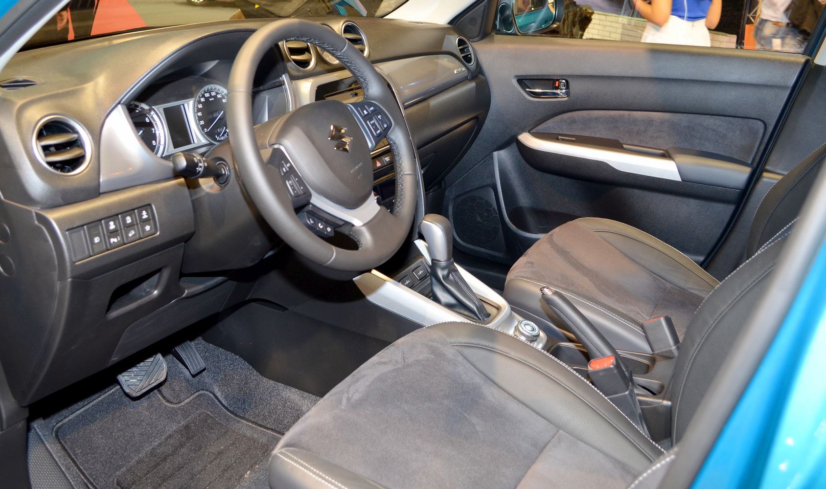 Modern dashboard and front seats with leather and fabric upholstery