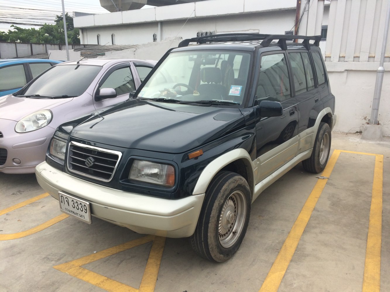 Classic SUV with roof rack and two-tone fender flares
