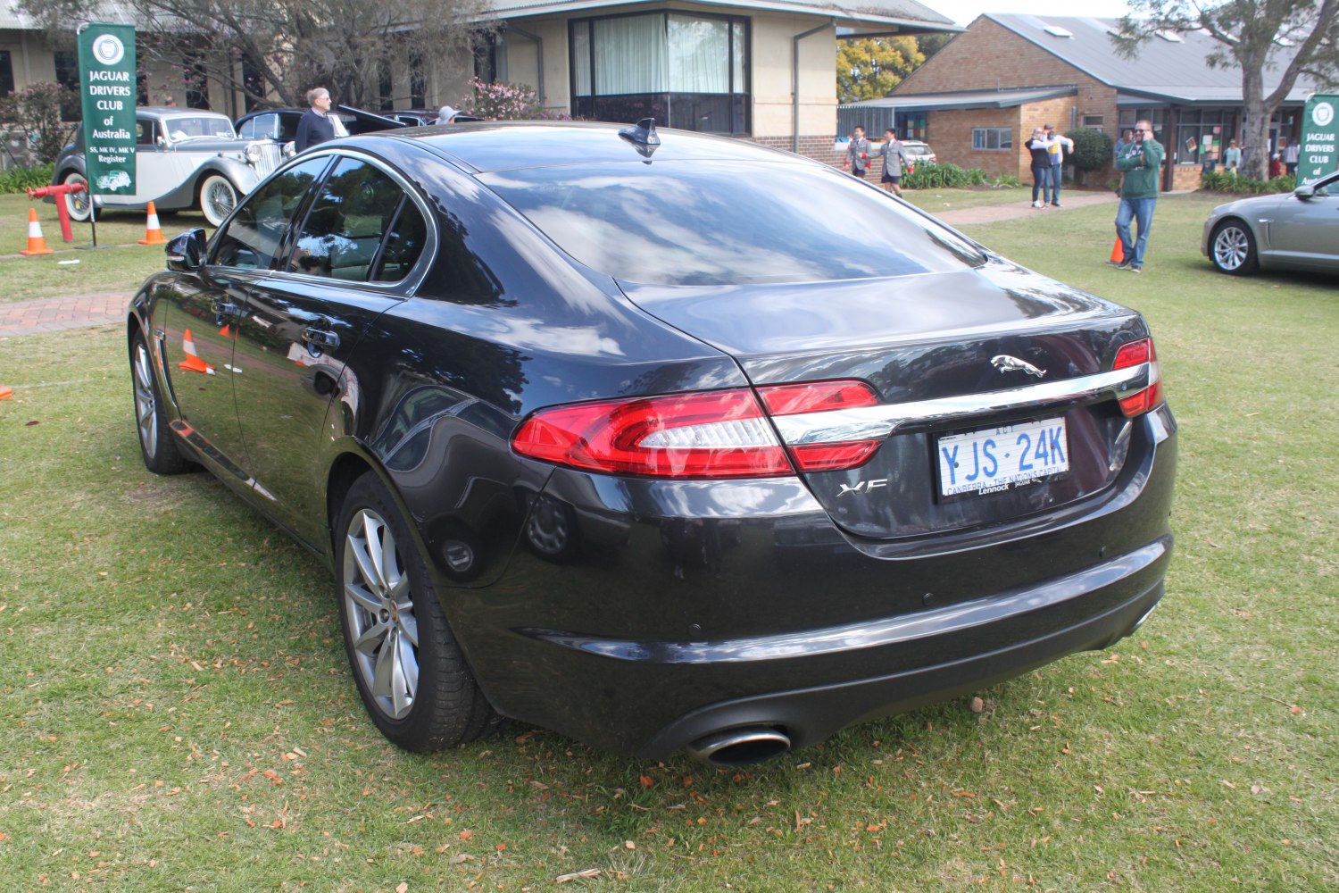 Rear view with distinctive tail lights and exhaust pipe.